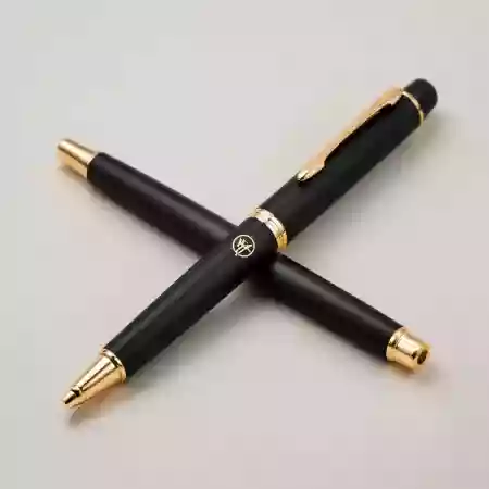 Engraved initials on luxury pen showcasing personalized monogram and custom lettering services for corporate gifts and personal use