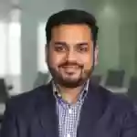 Vikram Nair executive portrait testimonial photo showcasing professional satisfaction with luxury pen and service quality